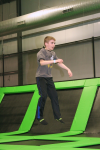 Young Boy Jumping on Trampoline
